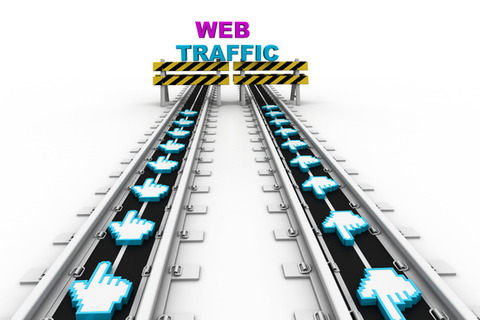 Two conveyor belts carry cursor icons toward a yellow and black barrier beneath the words "WEB TRAFFIC".