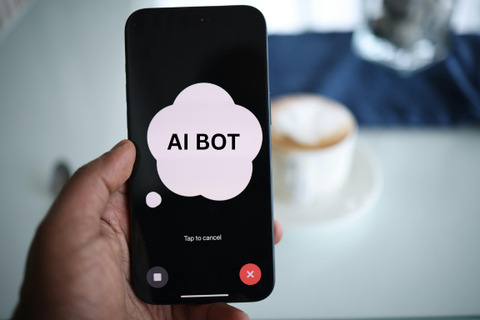 A cellphone with a large text bubble with AI Bot written in the middle 